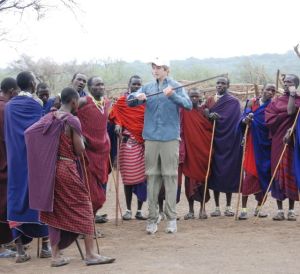 My grandson, Tim, explores the jumping dance with the Maasai.