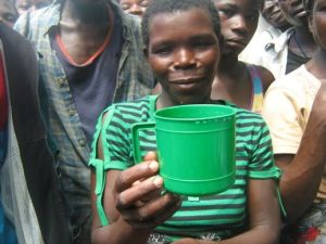 Flood victims in Chikwawa receive one cup of grain per day for their family's sustenance from the aid program that is available.