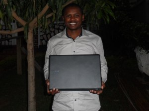 Prudence received his laptop and shared a photo and his thanks to donors. 
